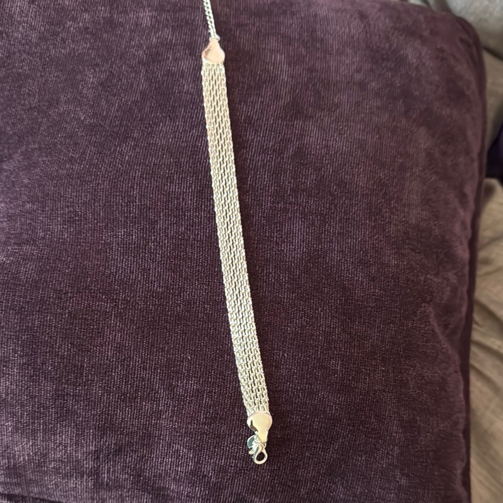 Elegant Silver Braided Bracelet with Secure Clasp